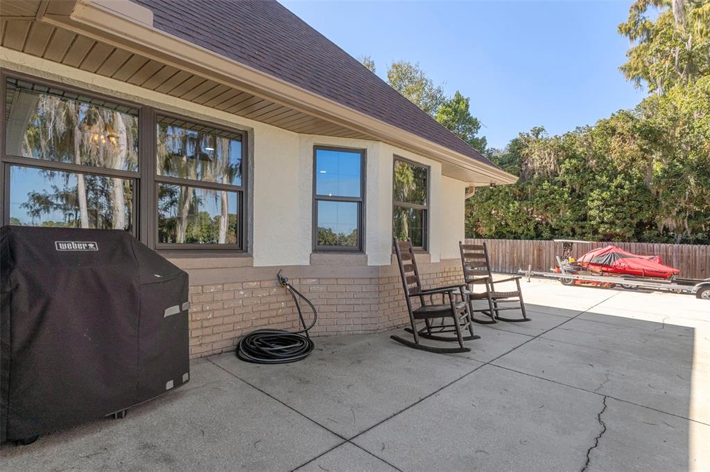 1425 South Homestead Point Inverness, FL 34450 - Photo 41 of 72 a view of a patio with table and chairs and potted plants
