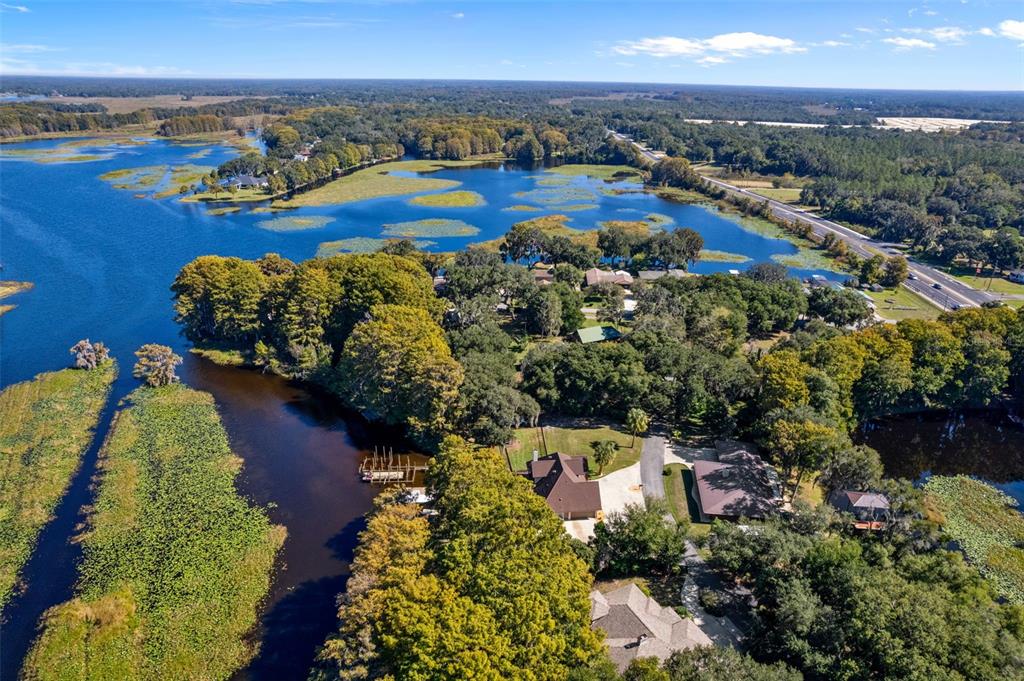 1425 South Homestead Point Inverness, FL 34450 - Photo 63 of 72 an aerial view of a house with a garden