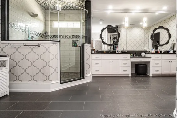 a view of a patio with table and chairs potted plants and large tree