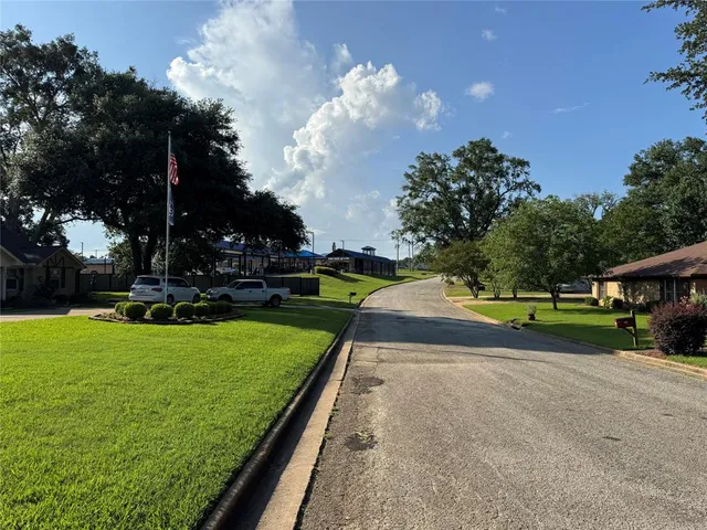a view of a golf course with a house