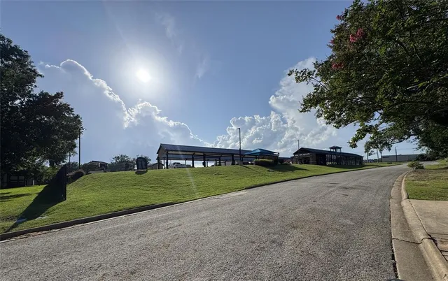 a view of a house with a yard and a garage