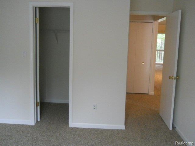 904 Ridge Court, Unit 123 Brighton, MI 48116 - Photo 19 of 23 2nd bedroom w walk-in.jpg