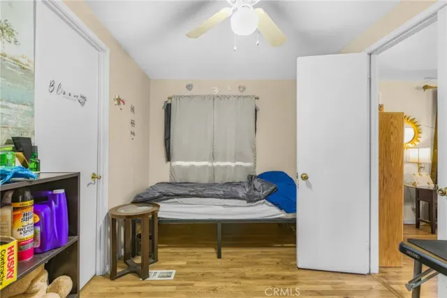 a living room with furniture and a book shelf