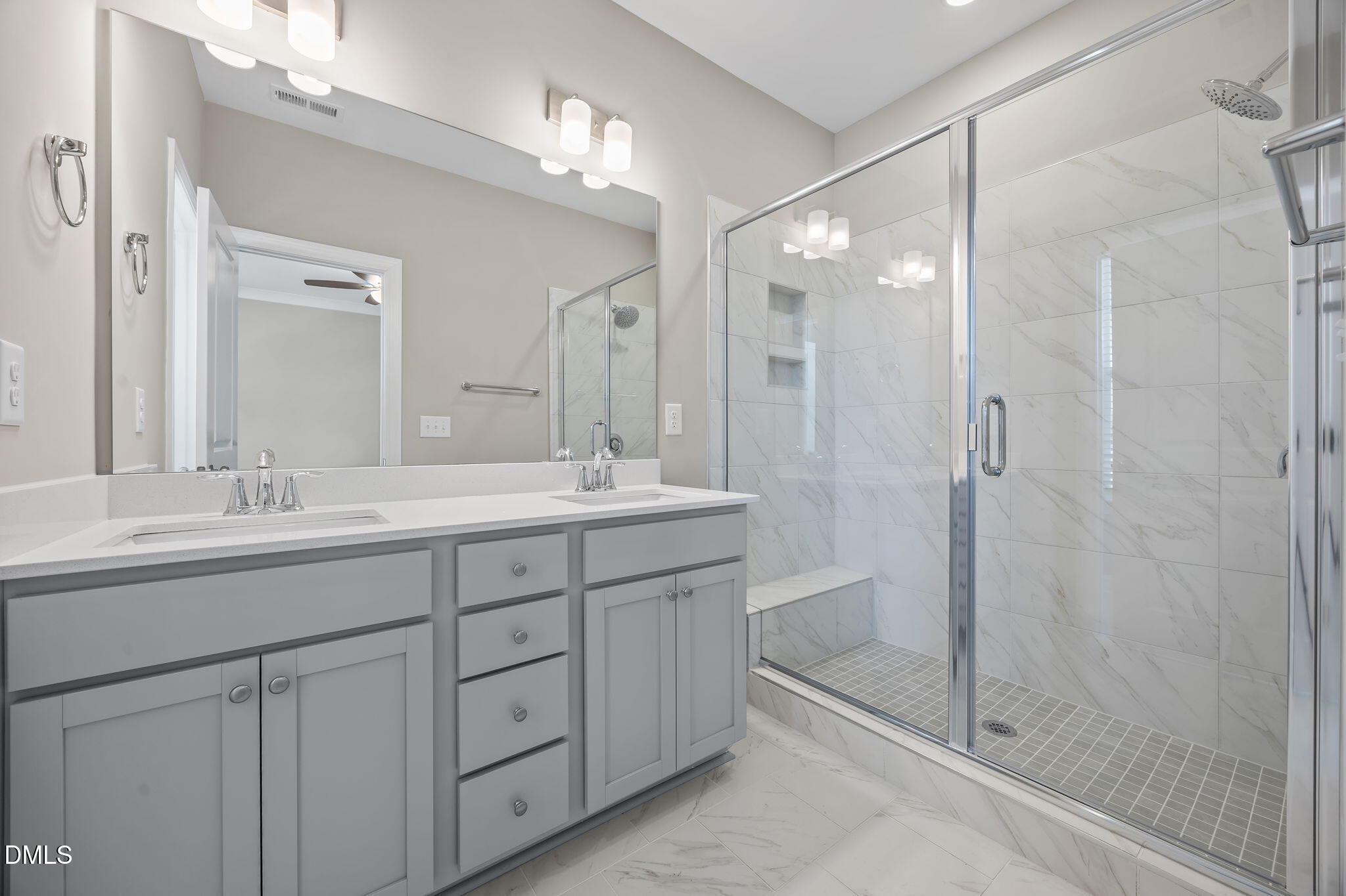 141 Pearl Street, Unit 9 Garner, NC 27529 - Photo 15 of 26 a bathroom with double sink and shower