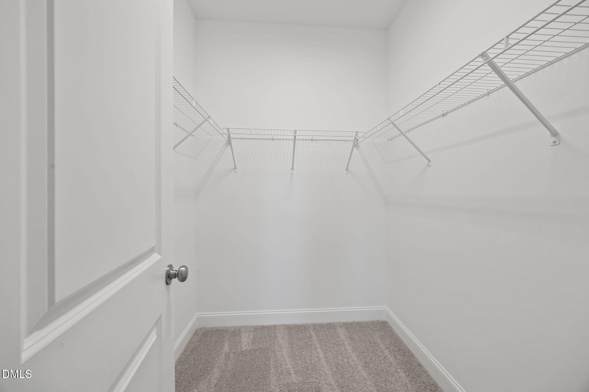 141 Pearl Street, Unit 9 Garner, NC 27529 - Photo 16 of 26 a view of a room with racks on the wall