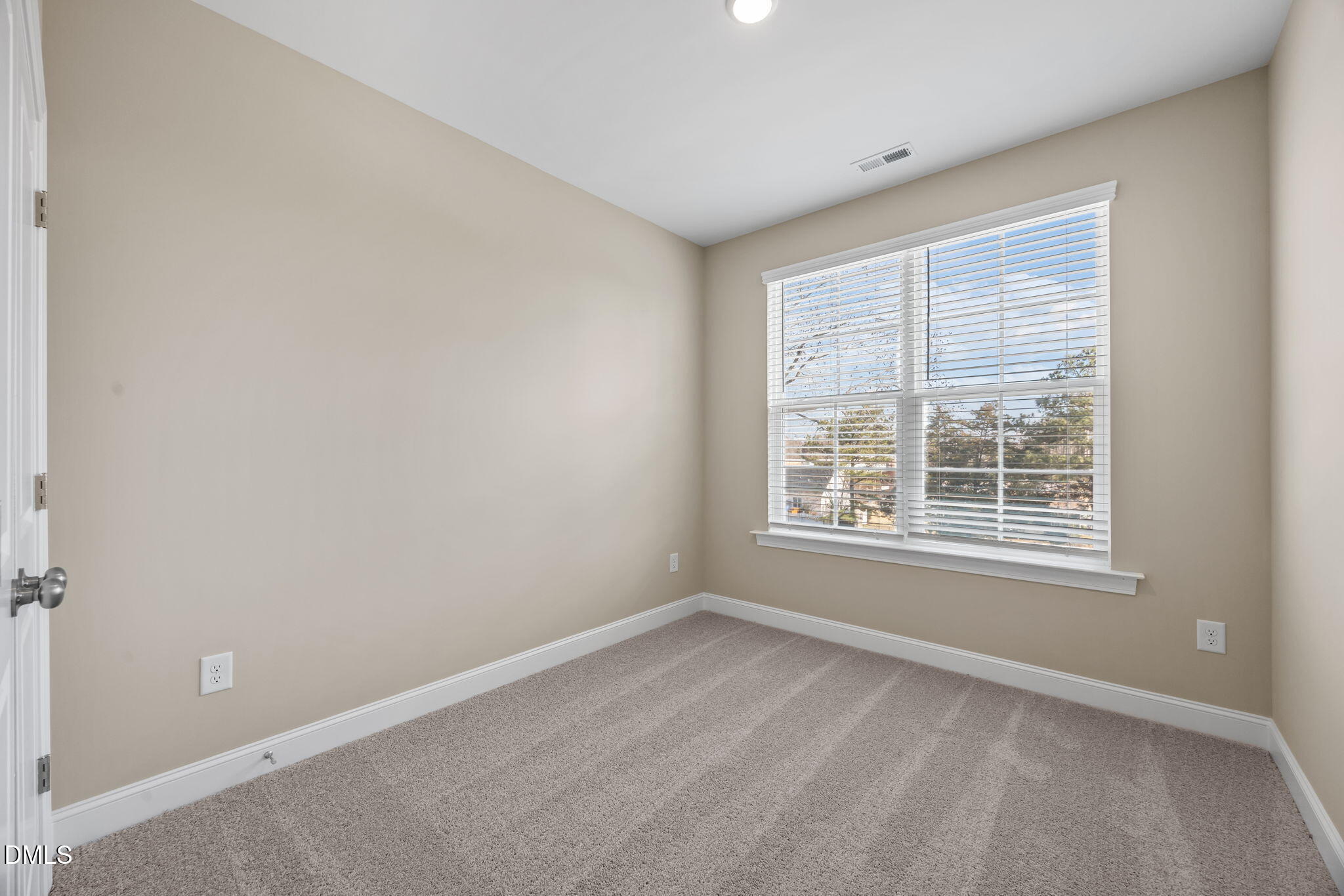 141 Pearl Street, Unit 9 Garner, NC 27529 - Photo 17 of 26 an empty room with a window
