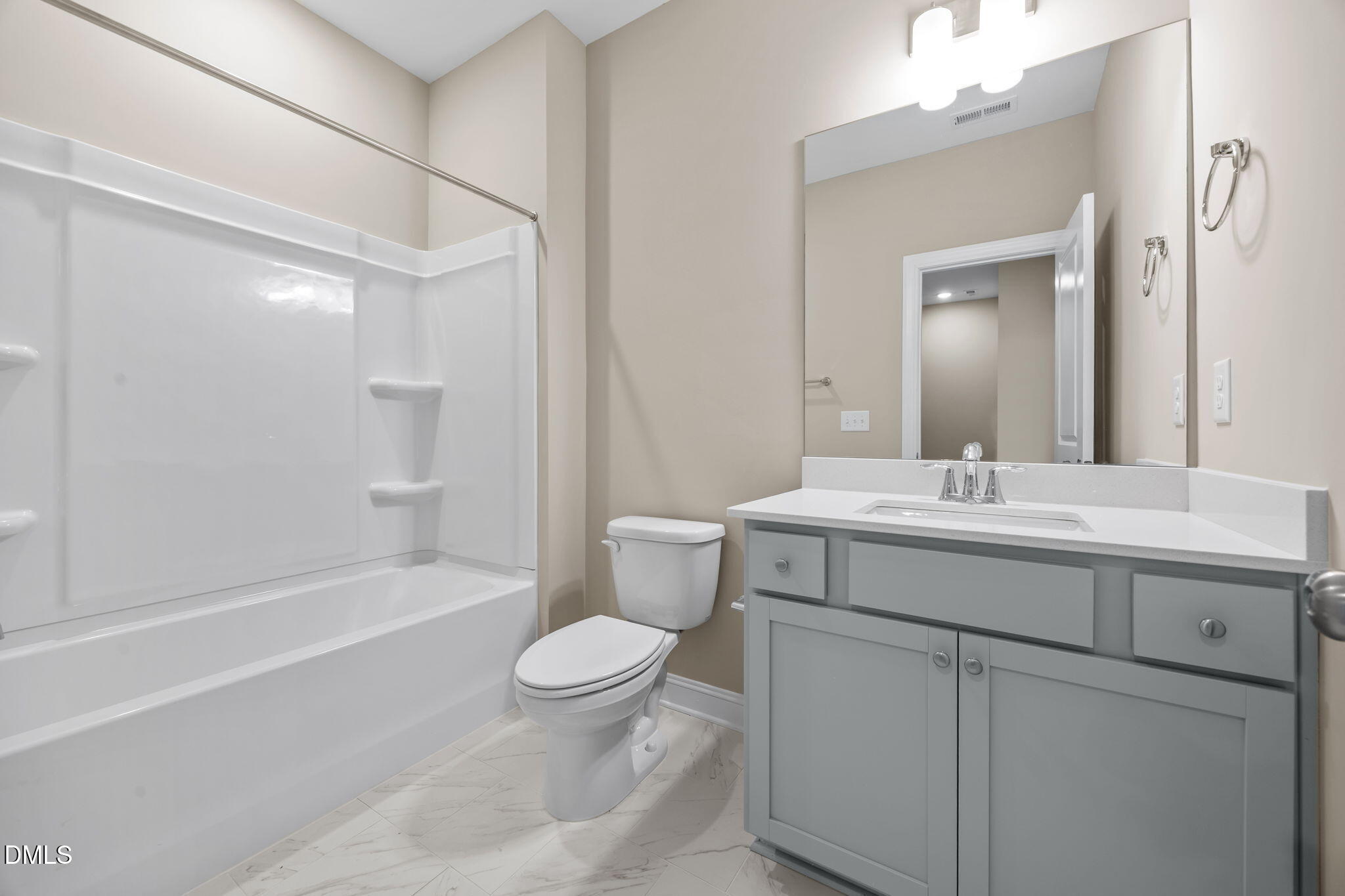 141 Pearl Street, Unit 9 Garner, NC 27529 - Photo 18 of 26 a bathroom with a sink toilet vanity and shower