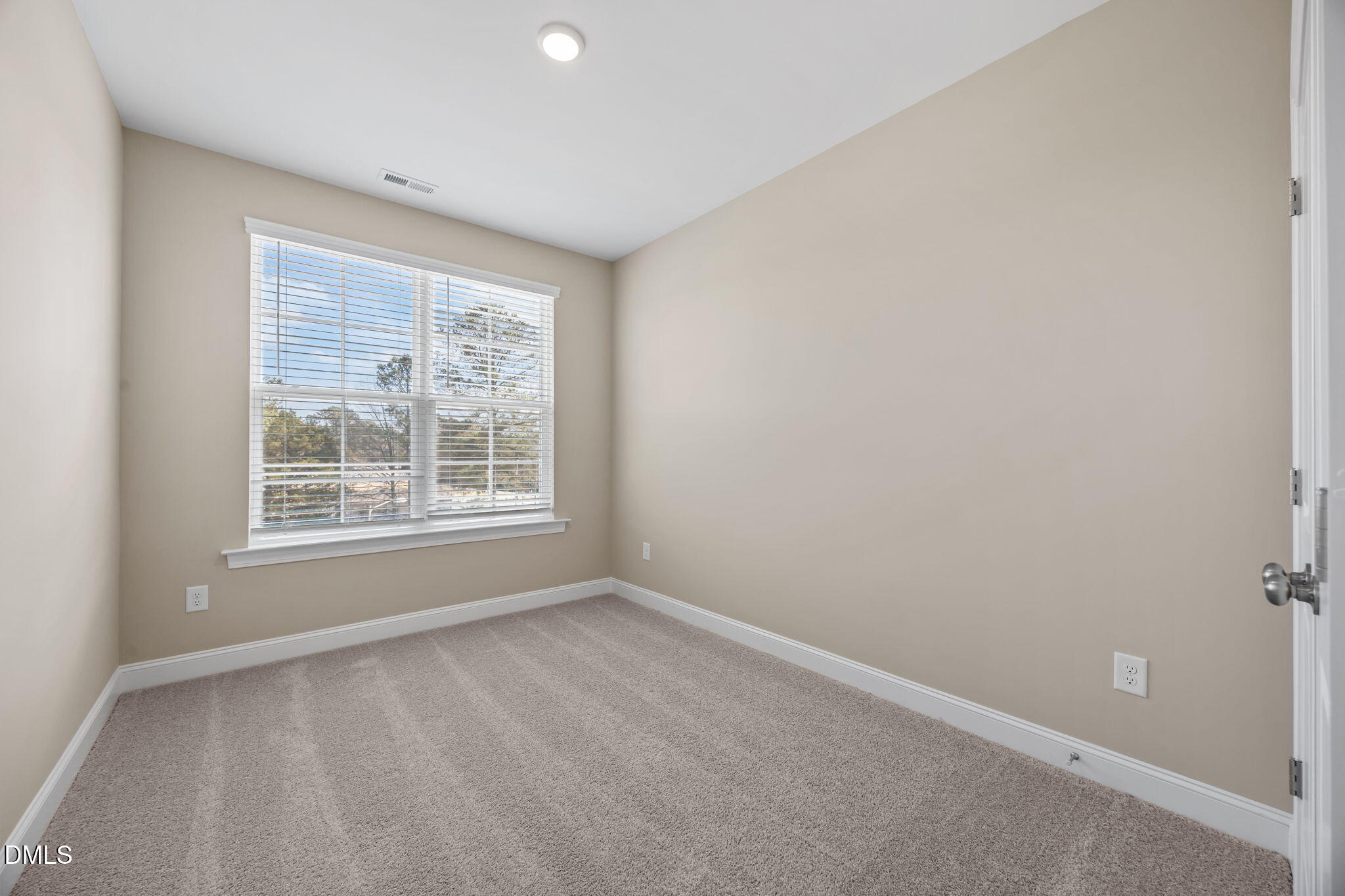 141 Pearl Street, Unit 9 Garner, NC 27529 - Photo 19 of 26 an empty room with a window