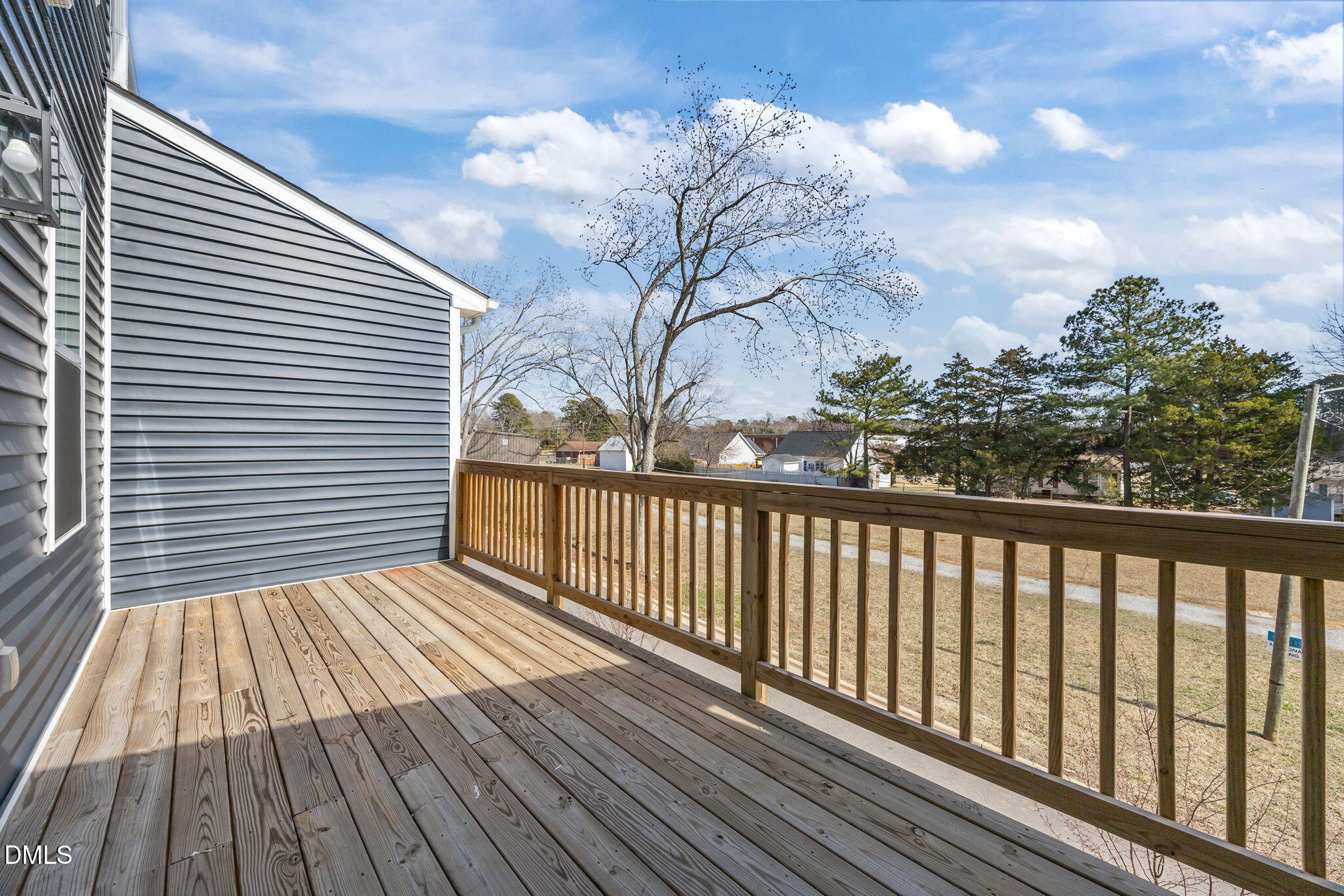141 Pearl Street, Unit 9 Garner, NC 27529 - Photo 22 of 26 a view of backyard with a deck