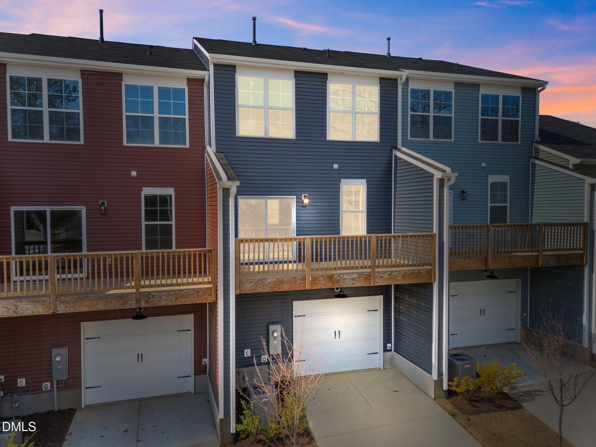 141 Pearl Street, Unit 9 Garner, NC 27529 - Photo 23 of 26 a view of a house with a barbeque and more windows