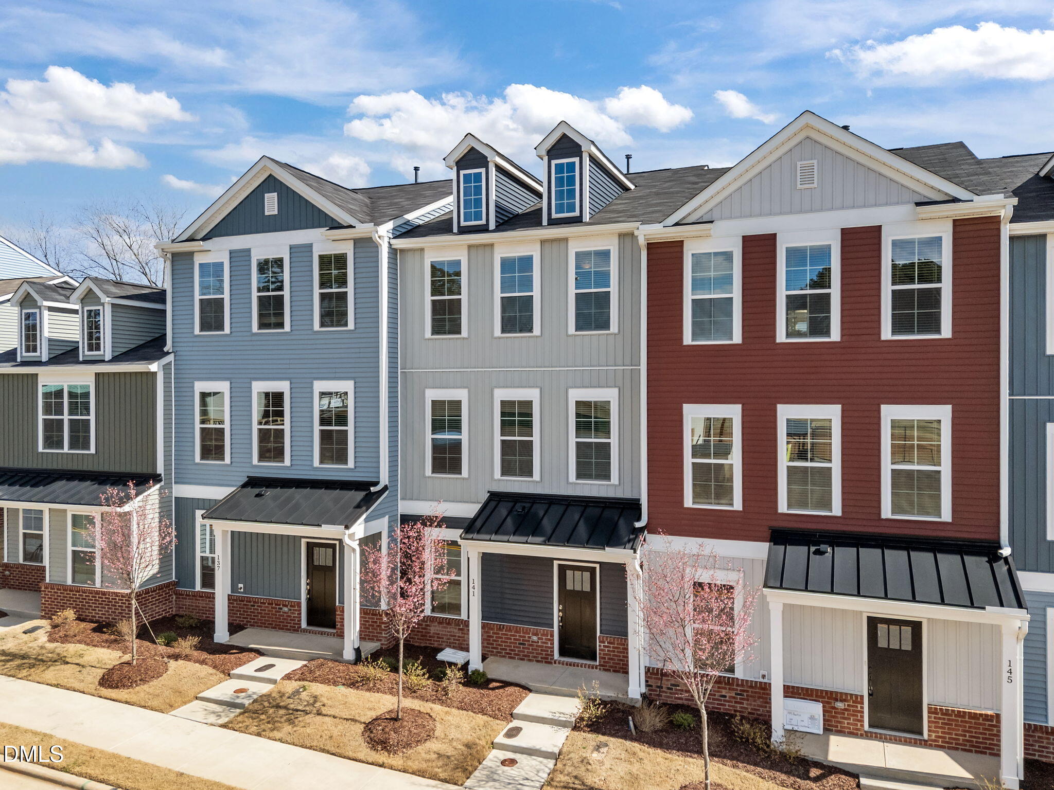 141 Pearl Street, Unit 9 Garner, NC 27529 - Photo 3 of 26 a front view of a building with street