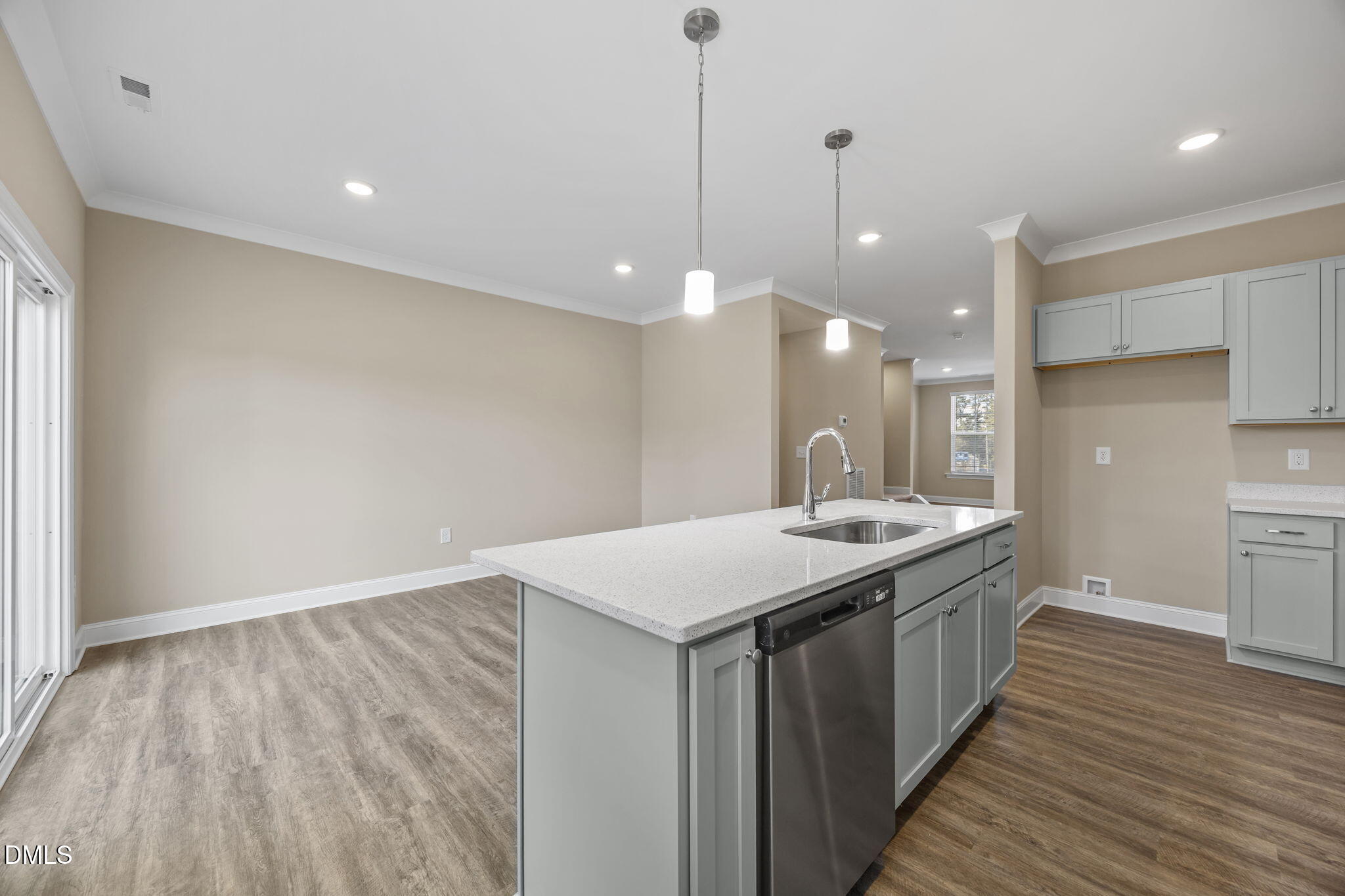 141 Pearl Street, Unit 9 Garner, NC 27529 - Photo 9 of 26 a kitchen with a sink and a wooden floor