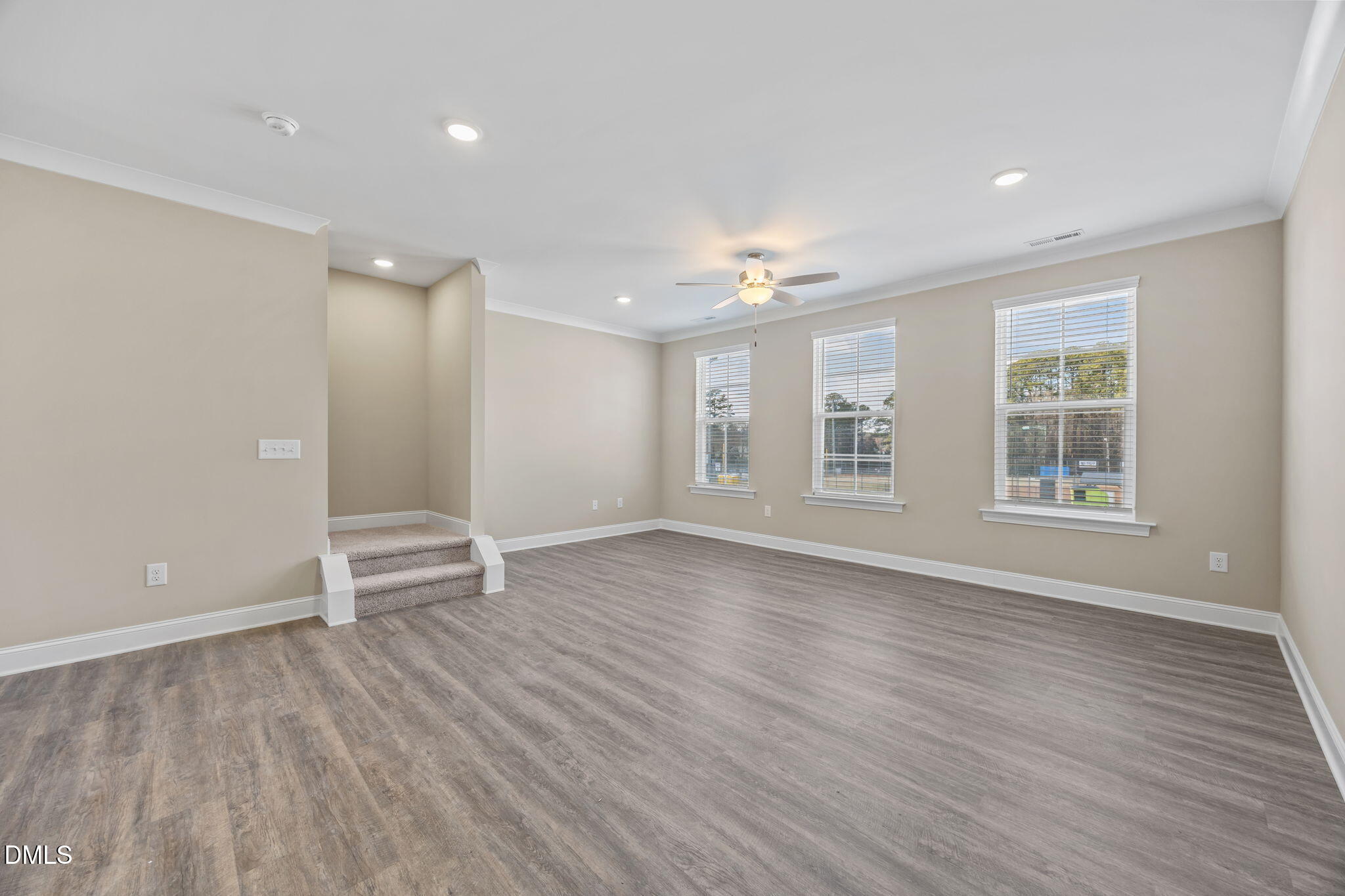 141 Pearl Street, Unit 9 Garner, NC 27529 - Photo 10 of 26 wooden floor in an empty room with a window