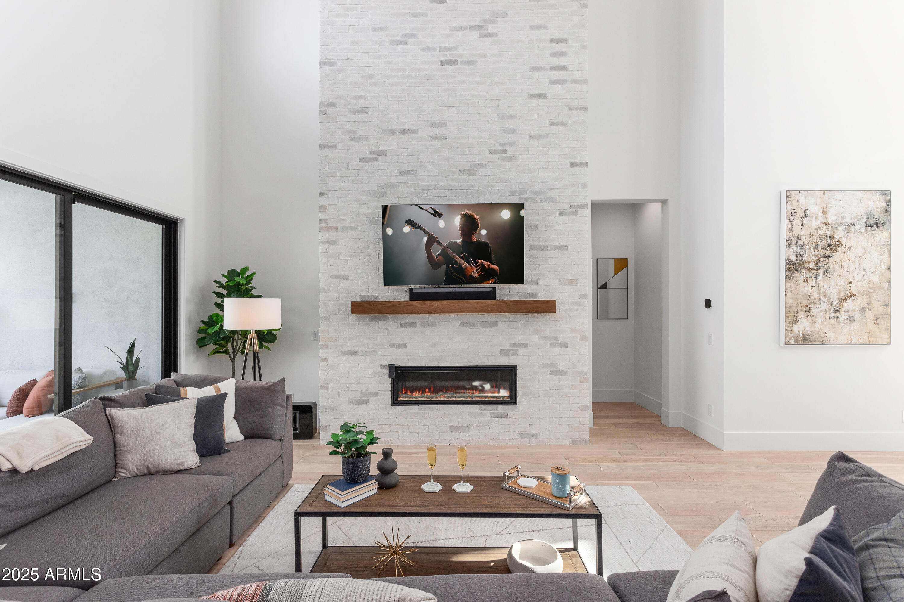 4007 North 34th Street Phoenix, AZ 85018 - Photo 13 of 43 a living room with furniture and a fireplace