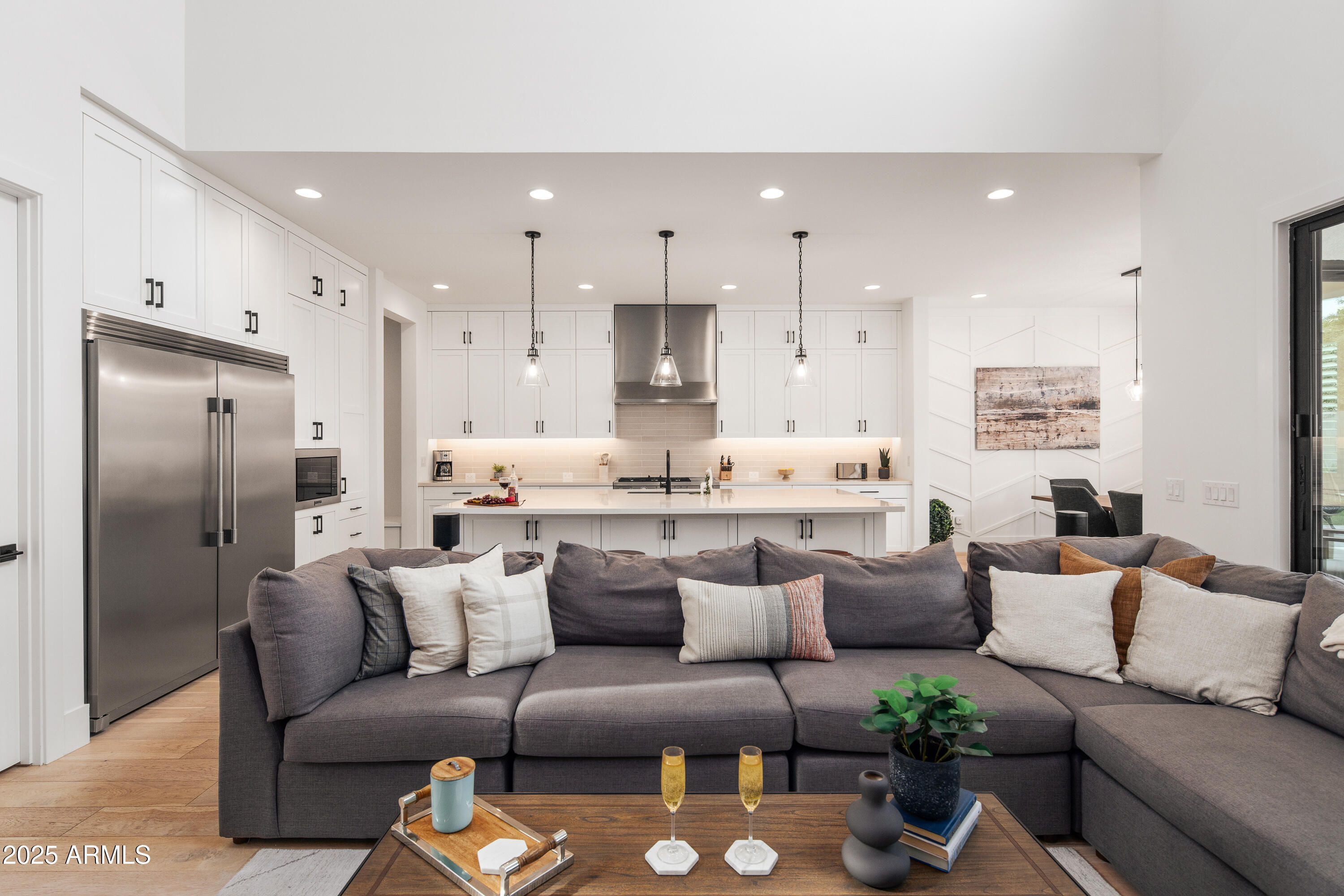 4007 North 34th Street Phoenix, AZ 85018 - Photo 15 of 43 a living room with furniture kitchen and a chandelier