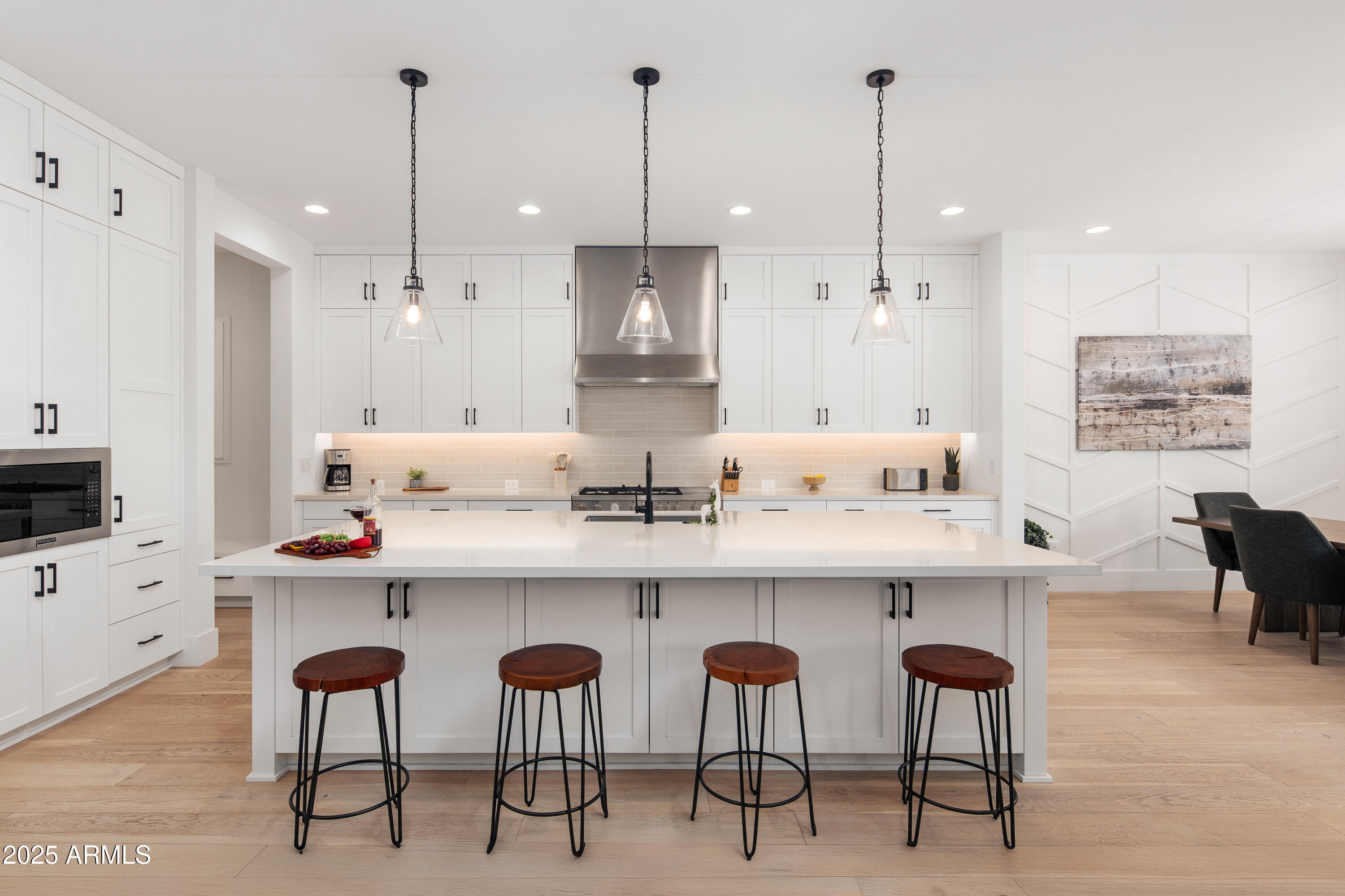 4007 North 34th Street Phoenix, AZ 85018 - Photo 16 of 43 a kitchen with cabinets and chairs