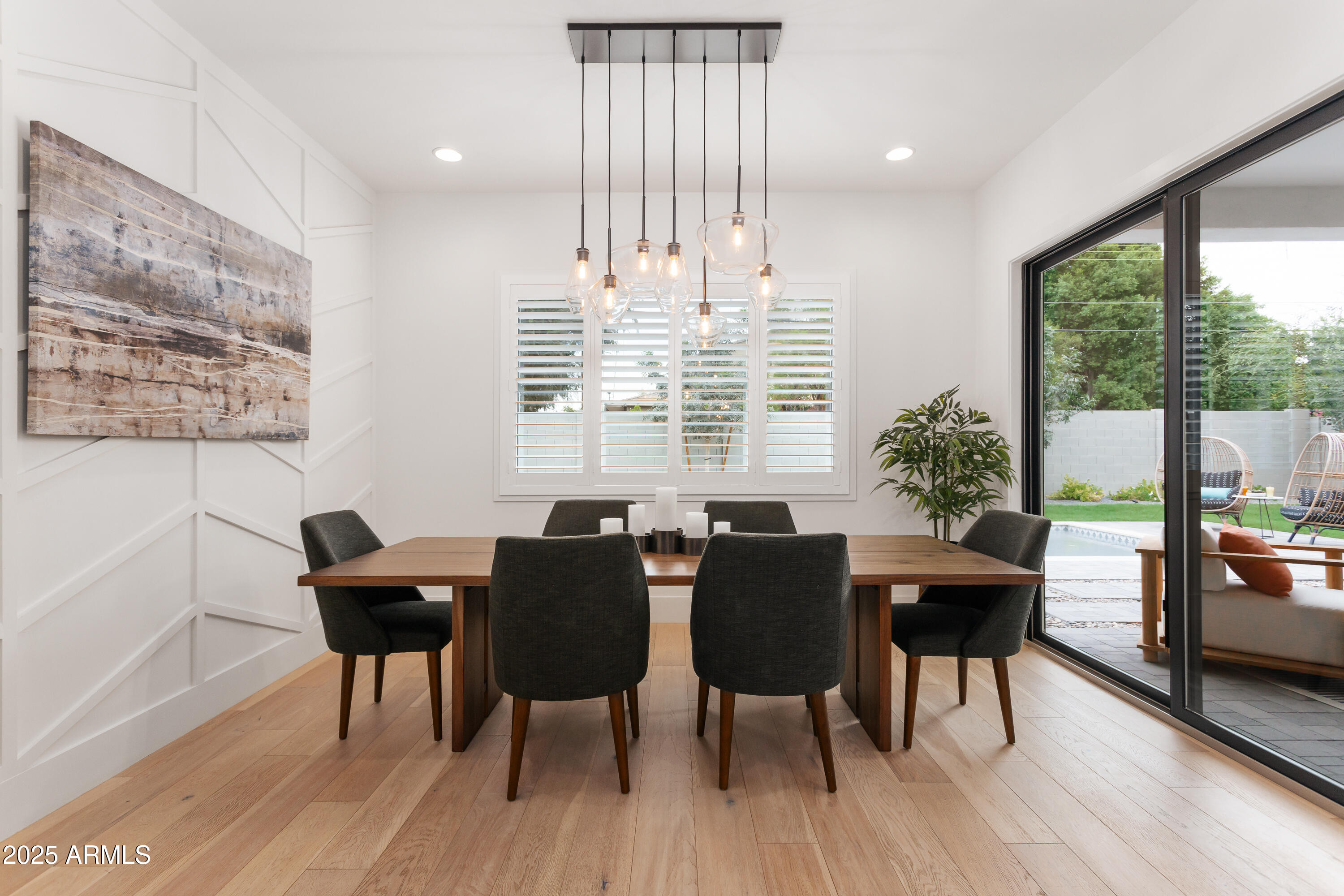 4007 North 34th Street Phoenix, AZ 85018 - Photo 19 of 43 a view of a dining room with furniture window and wooden floor