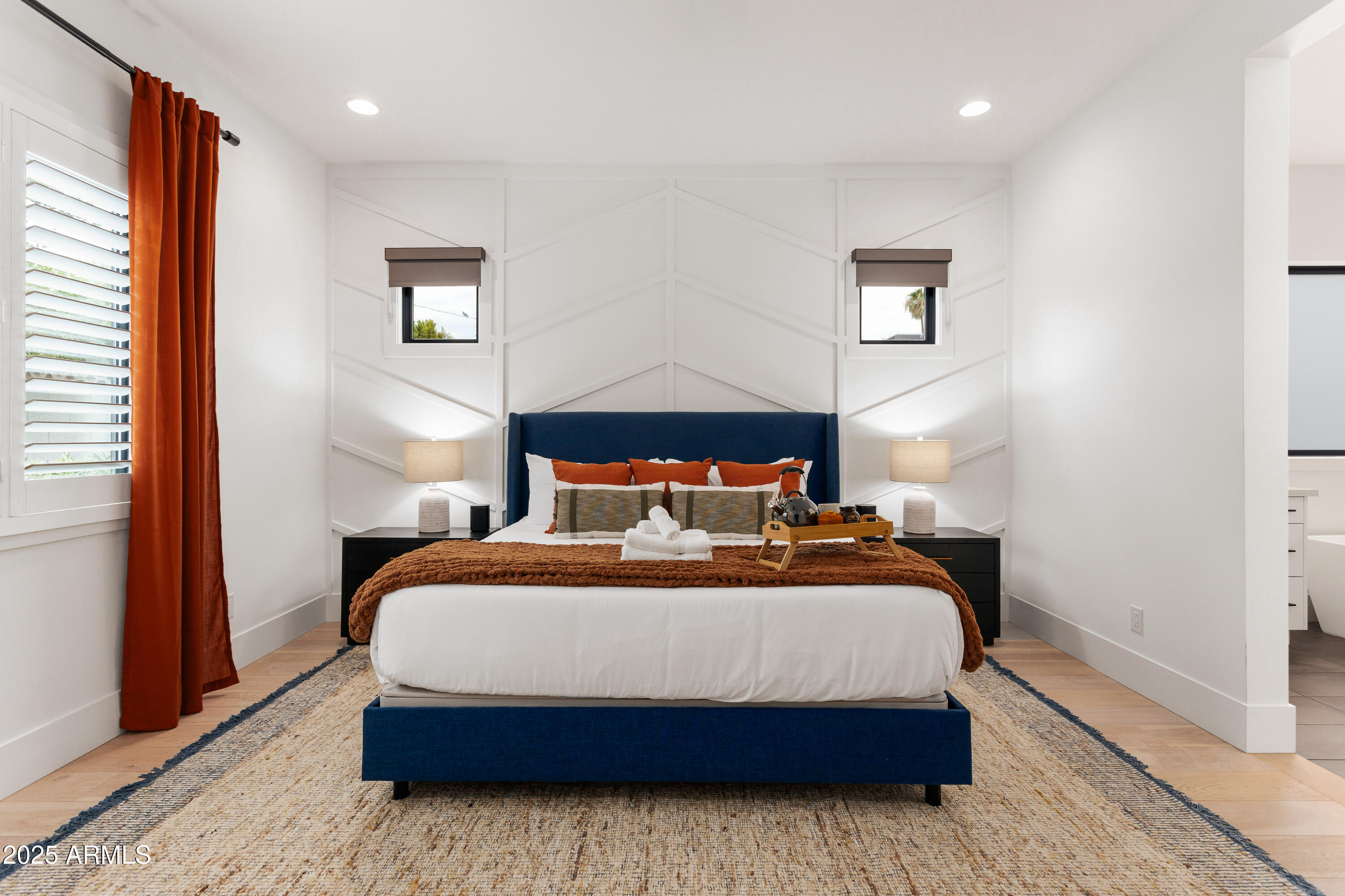 4007 North 34th Street Phoenix, AZ 85018 - Photo 20 of 43 a bedroom with a bed and wooden floor