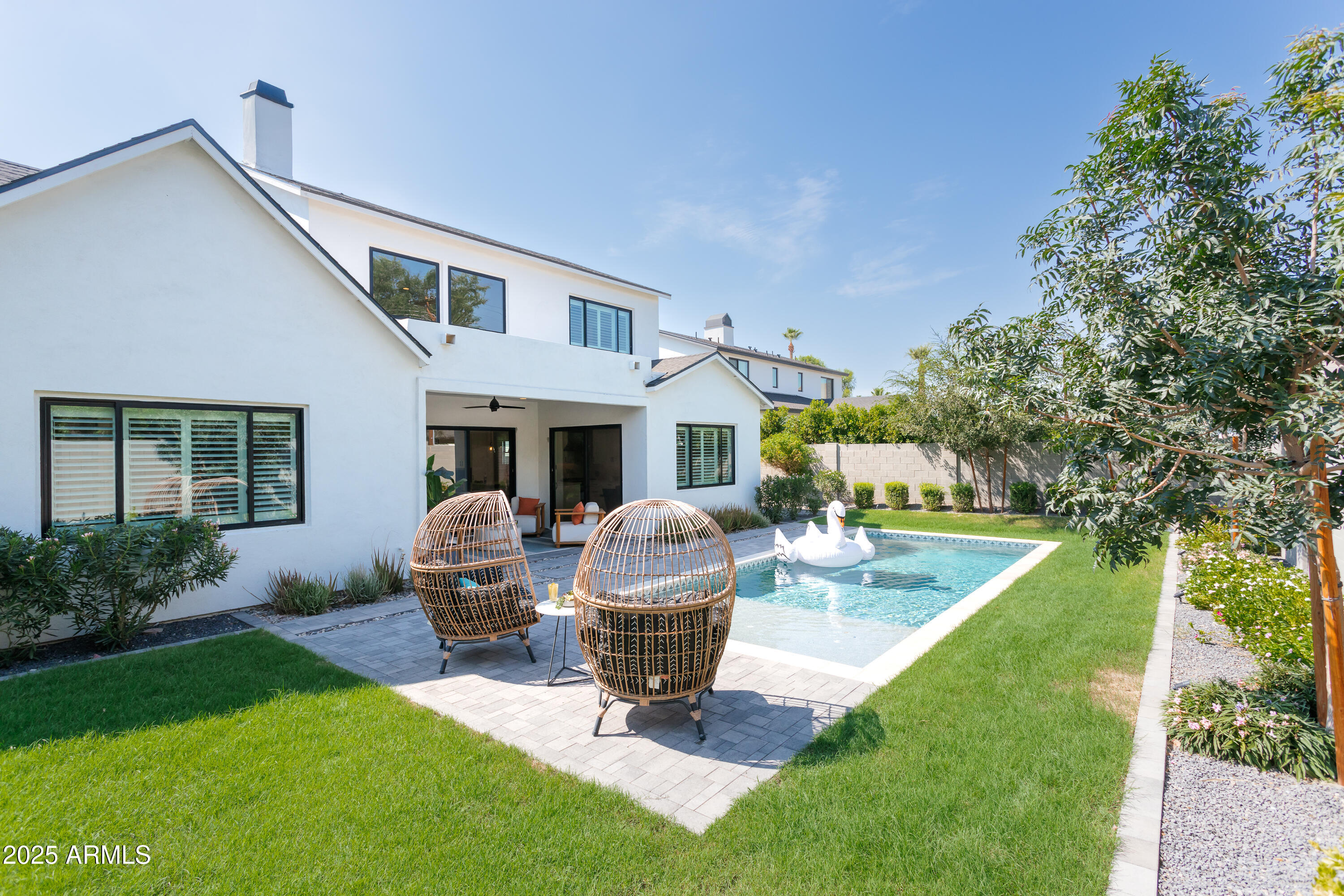 4007 North 34th Street Phoenix, AZ 85018 - Photo 3 of 43 a view of a house with backyard sitting area and garden