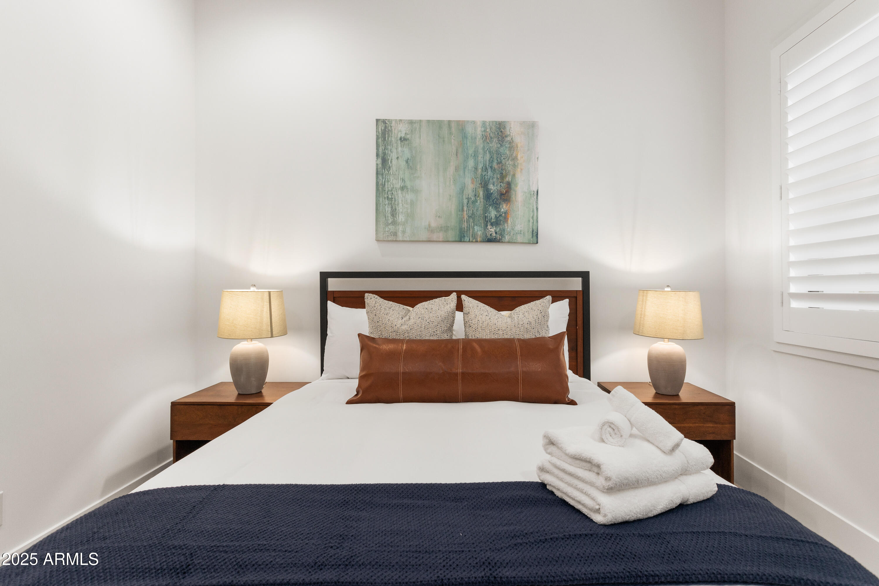 4007 North 34th Street Phoenix, AZ 85018 - Photo 32 of 43 a bedroom with a bed and a night stand