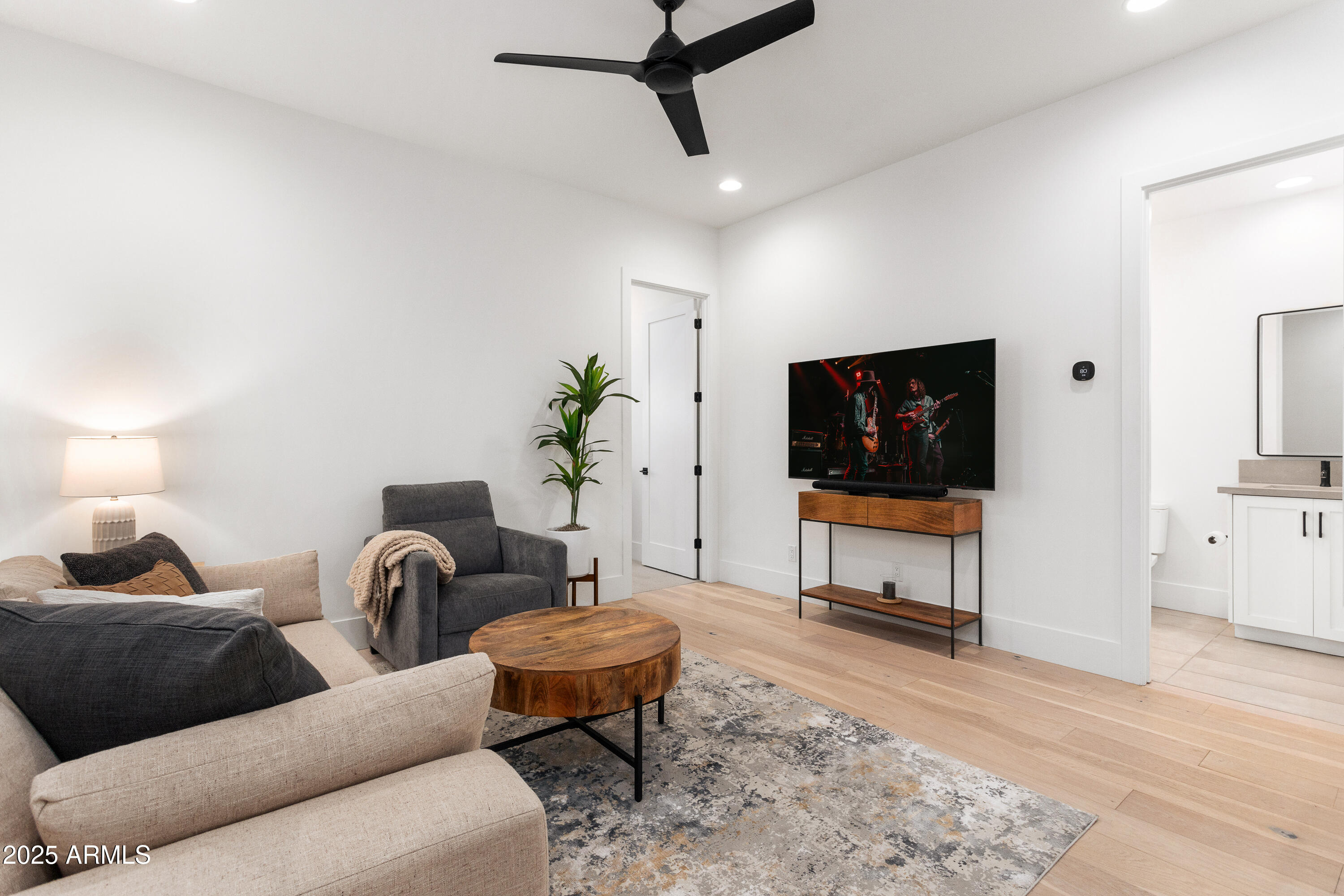 4007 North 34th Street Phoenix, AZ 85018 - Photo 33 of 43 a living room with furniture and a flat screen tv
