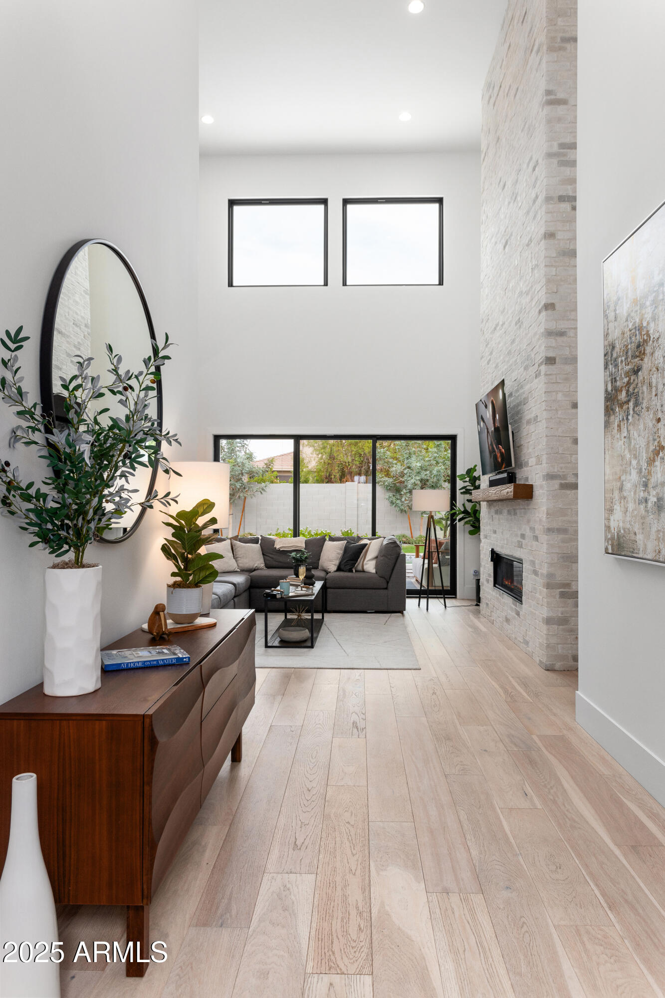 4007 North 34th Street Phoenix, AZ 85018 - Photo 10 of 43 a living room with furniture a potted plant and a table