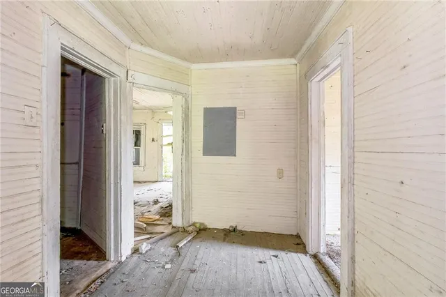 a view of wooden floor in an empty room