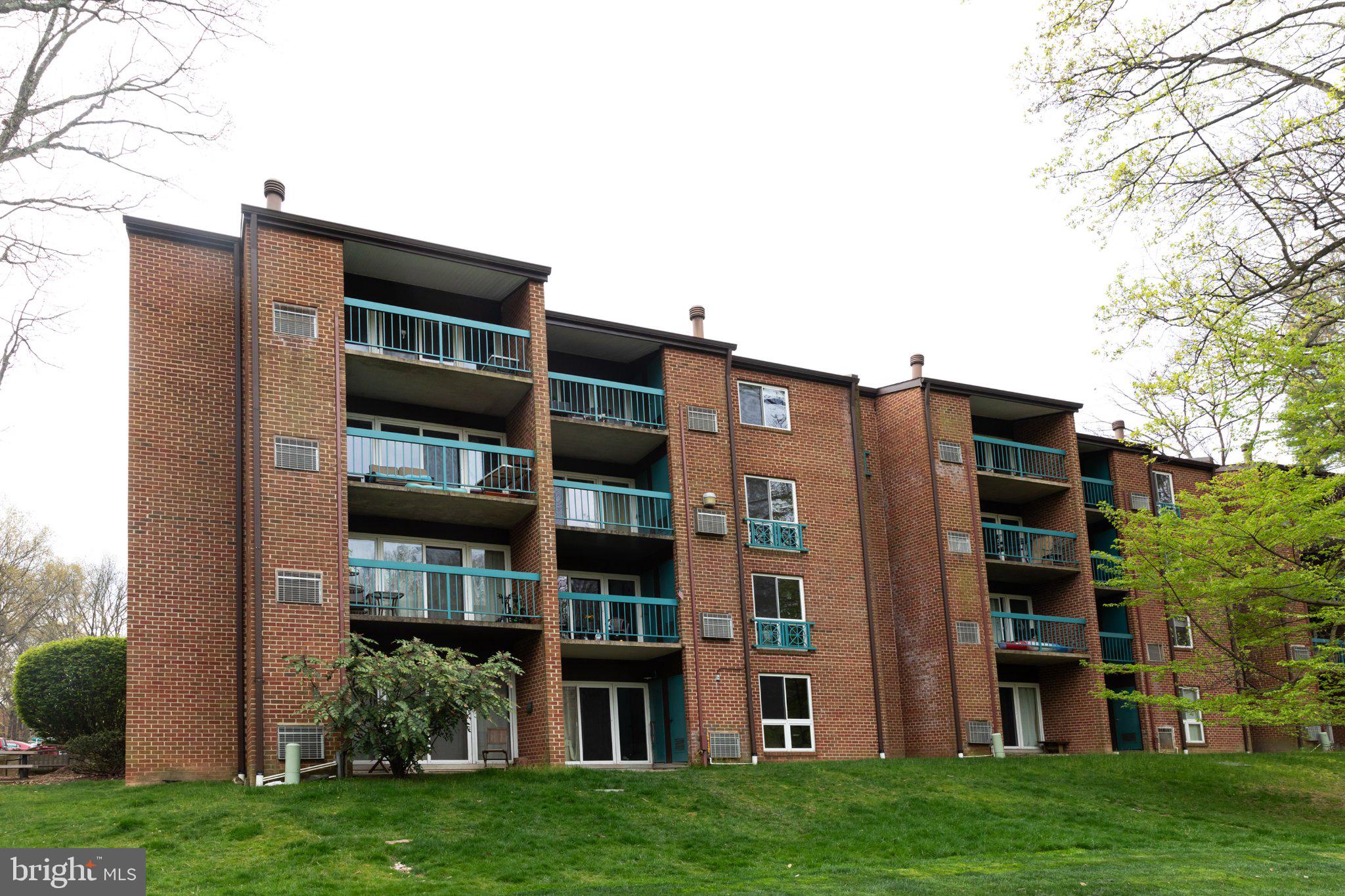 11804 Breton Court, Unit 21 Reston, VA 20191 - Photo 17 of 18 Charming brick apartments with balconies.