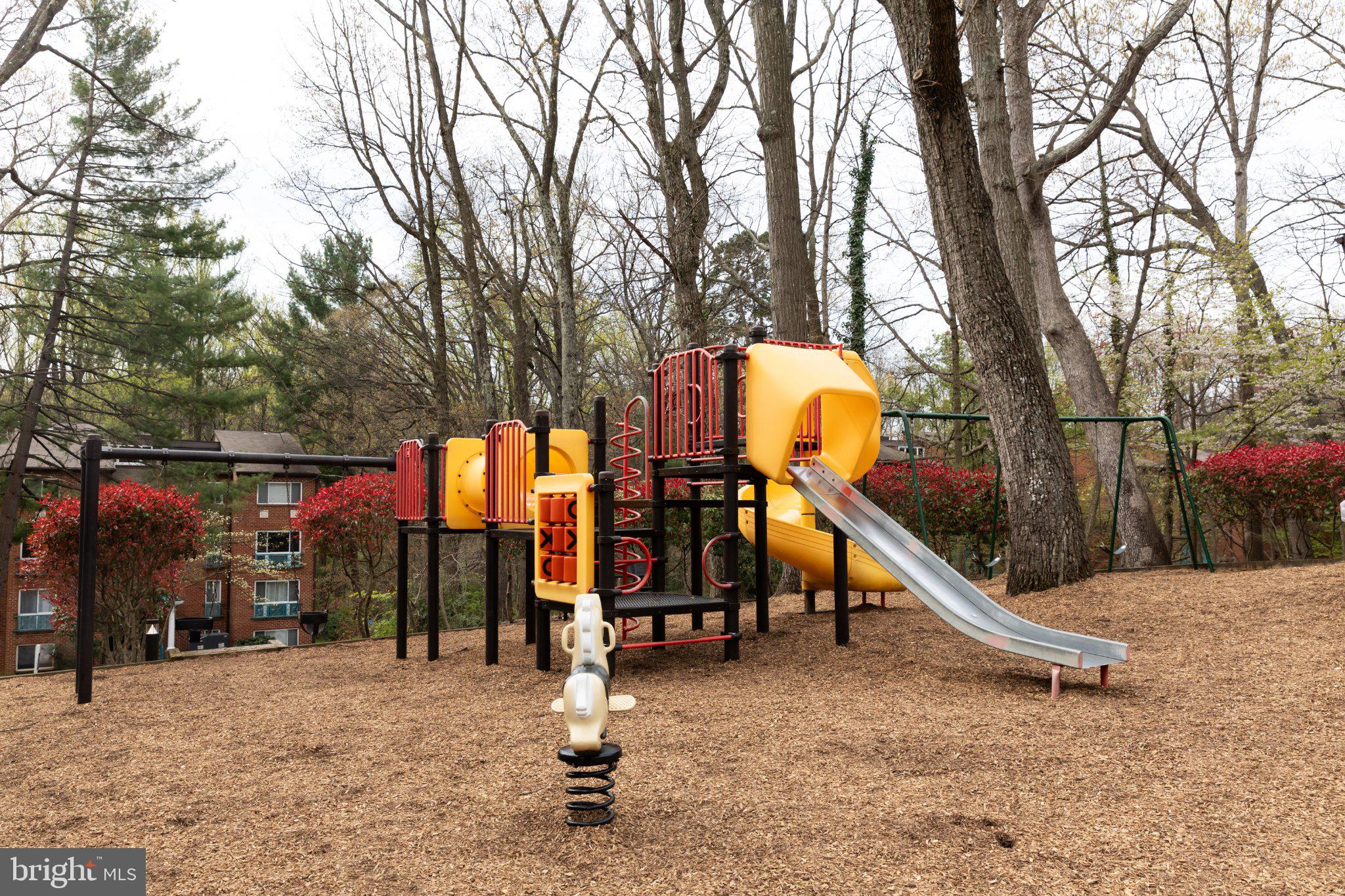 11804 Breton Court, Unit 21 Reston, VA 20191 - Photo 18 of 18 Colorful playground in a serene park.