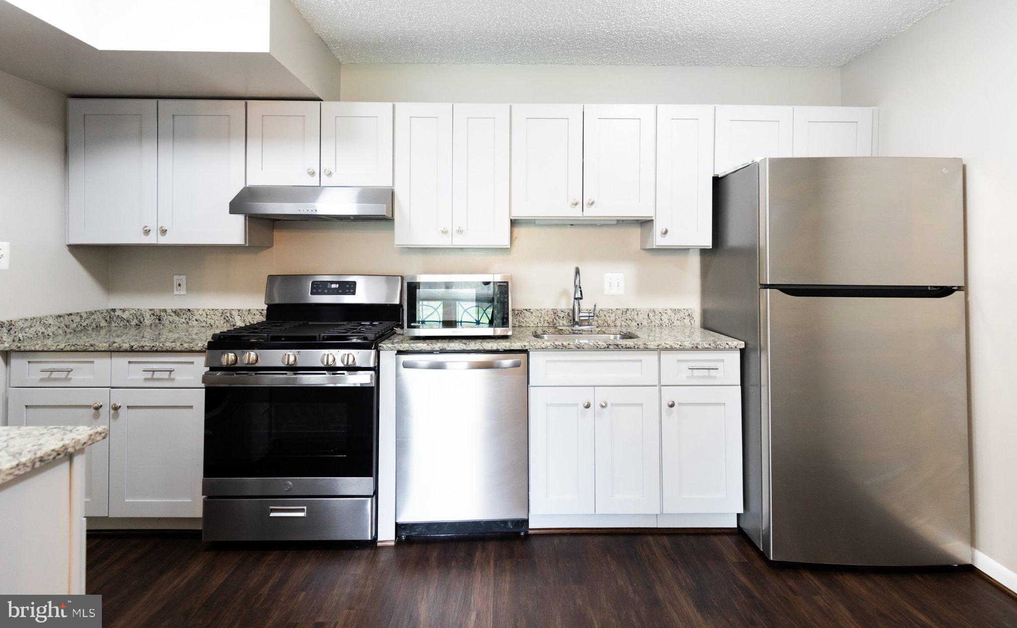 11804 Breton Court, Unit 21 Reston, VA 20191 - Photo 2 of 18 Modern kitchen with sleek finishes.