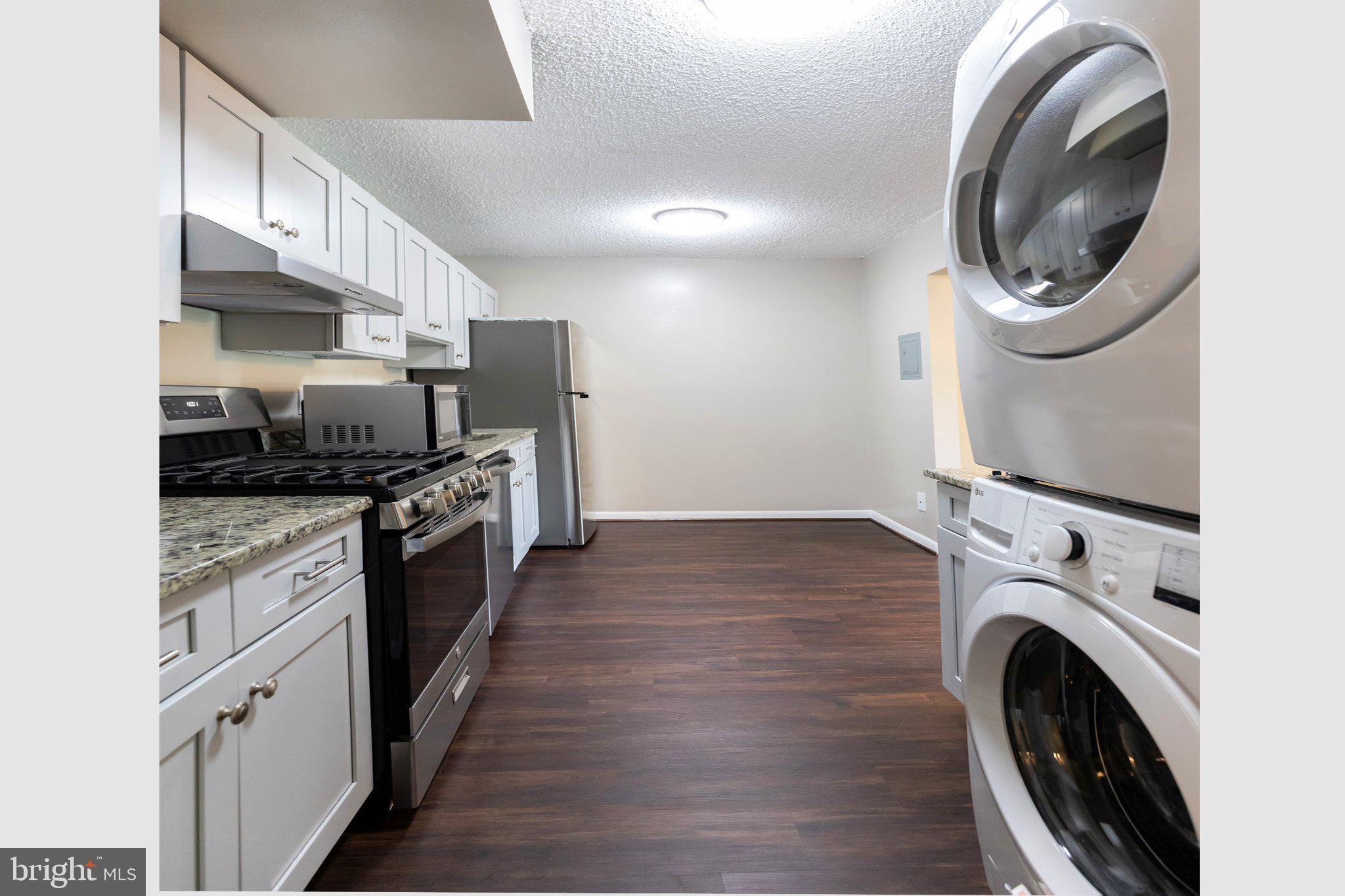 11804 Breton Court, Unit 21 Reston, VA 20191 - Photo 3 of 18 Modern kitchen with laundry convenience.
