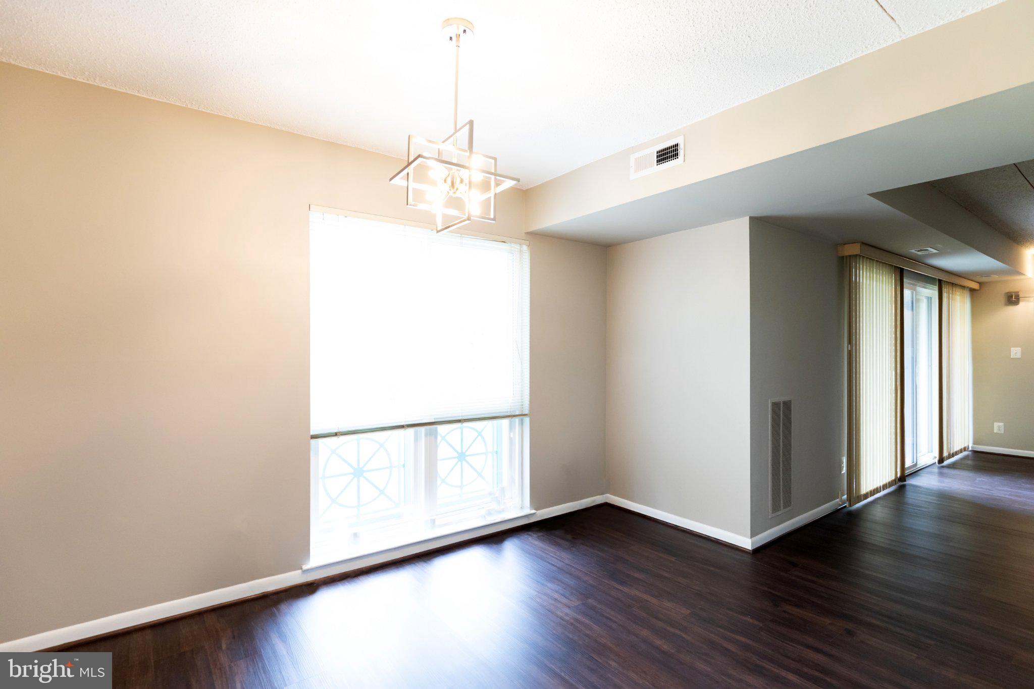 11804 Breton Court, Unit 21 Reston, VA 20191 - Photo 6 of 18 Bright and airy open space awaits.