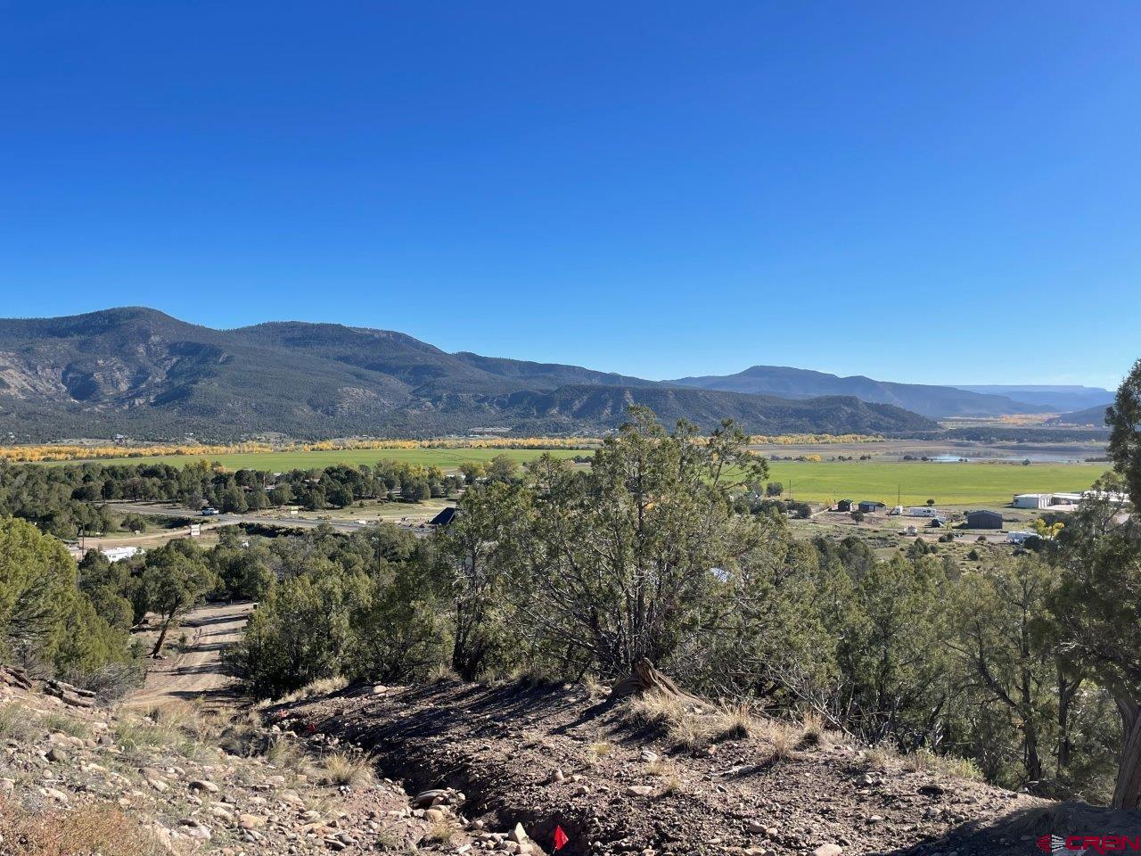 440 Run Around Road Arboles, CO 81121 - Photo 16 of 18 a view of a city with mountains in the background