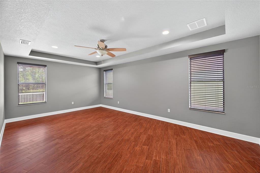 1120 Maza Place Trinity, FL 34655 - Photo 18 of 35 a view of an empty room with wooden floor and a window