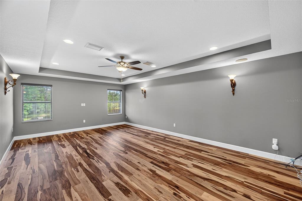 1120 Maza Place Trinity, FL 34655 - Photo 23 of 35 a view of an empty room with wooden floor and a window