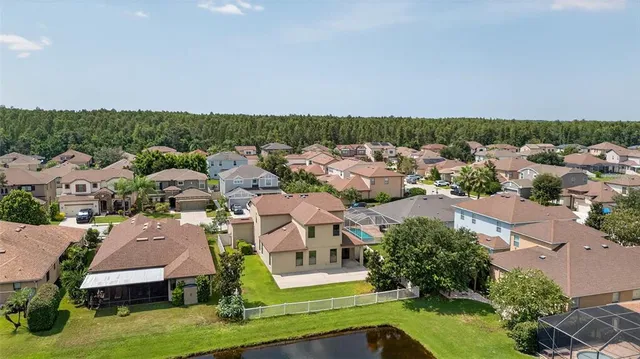an aerial view of a house with a garden