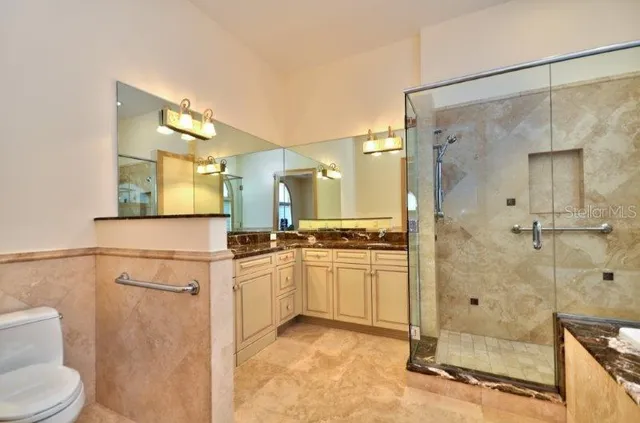 a large bathroom with a large tub and sink