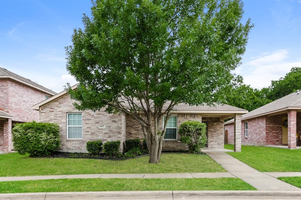 607 Lentisco Drive Lancaster, TX 75146 - Photo 1 of 1 a front view of a house with a yard