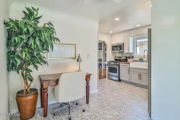 a kitchen with appliances and cabinets