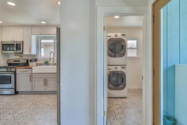 a view of a kitchen and washer and dryer