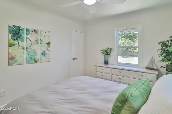 a bed room with a bed and a window