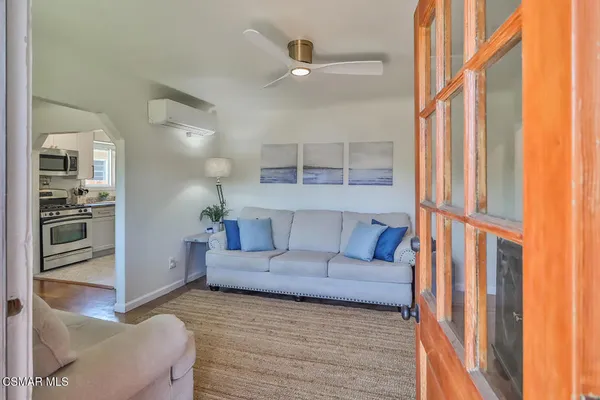 a living room with furniture and a large window