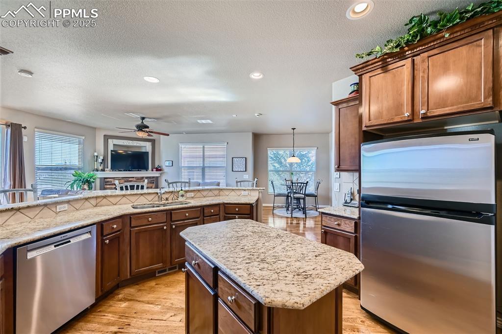 2553 Cinnabar Road Colorado Springs, CO 80921 - Photo 11 of 27 a kitchen with granite countertop stainless steel appliances and sink