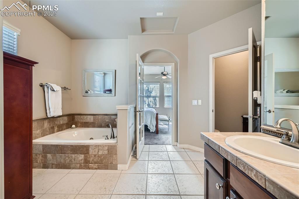 2553 Cinnabar Road Colorado Springs, CO 80921 - Photo 17 of 27 a bathroom with a sink and a mirror