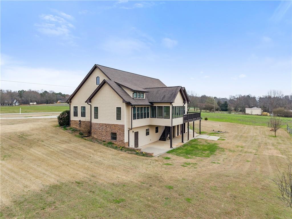 725 County Farm Road Jefferson, GA 30549 - Photo 51 of 66 a view of a house with a big yard and large tree
