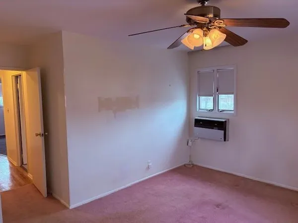 a view of an empty room with stairs