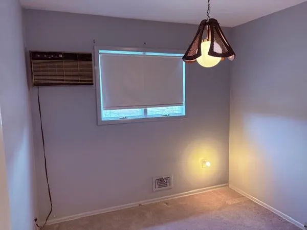 a view of a window in an empty room