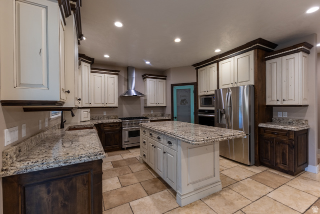 3565 West 1350th Street North Vernal, UT 84078 - Photo 12 of 54 Expansive kitchen featuring a large central island, full suite of stainless steel appliances, dual-tone cabinetry, granite countertops, and tile flooring