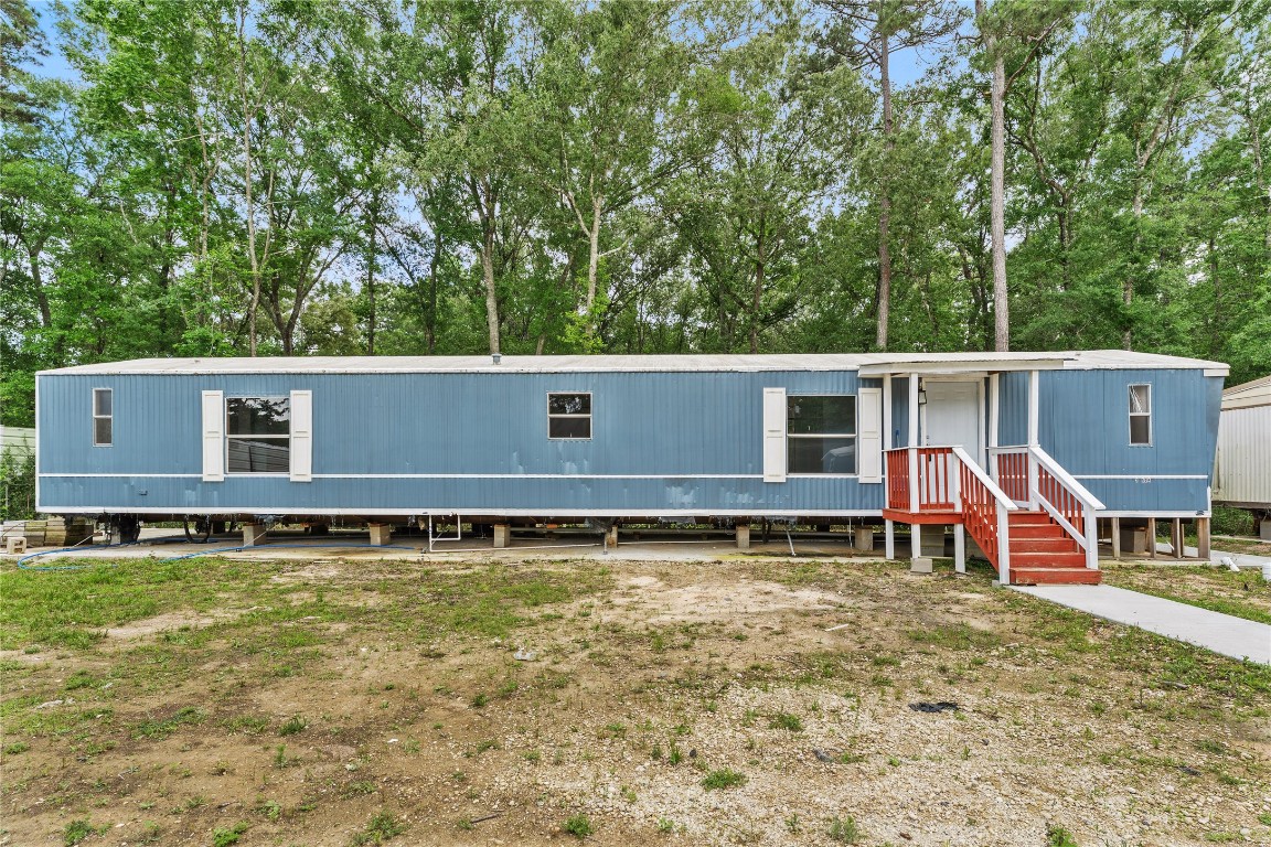 21504 Mexican John Road, Unit C New Caney, TX 77357 - Photo 15 of 15 an aerial view of a house with swimming pool and sitting area