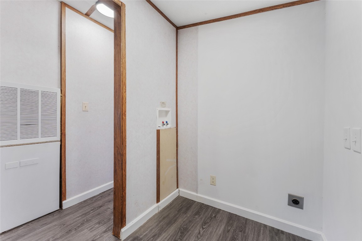 21504 Mexican John Road, Unit C New Caney, TX 77357 - Photo 3 of 15 a view of a hallway with wooden floor
